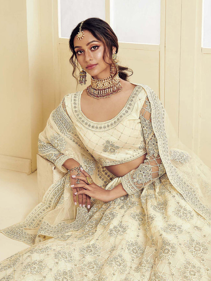 Off White Embroidered Net Semi Stitched Blouse Lehenga &amp; Dupatta