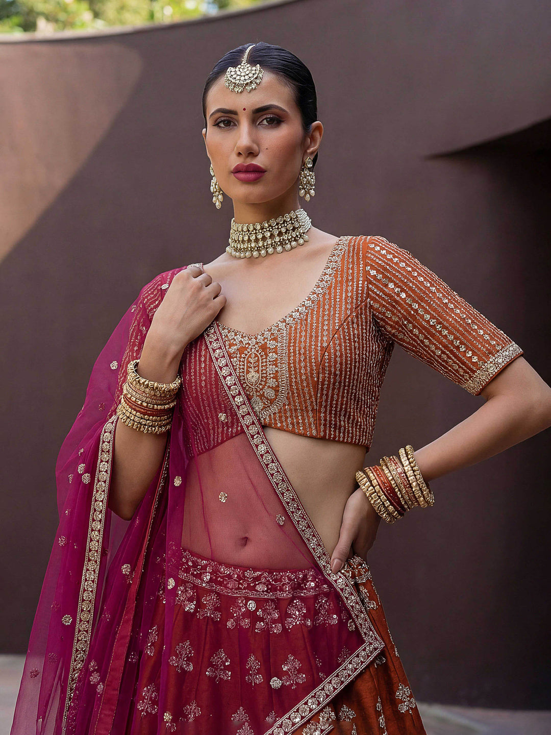 Orange Hlame Semi Stitched Bridal Lehenga Choli with Embroidered Net Dupatta